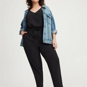Torrid Black Jumpsuit with V-Neckline and Relaxed Fit